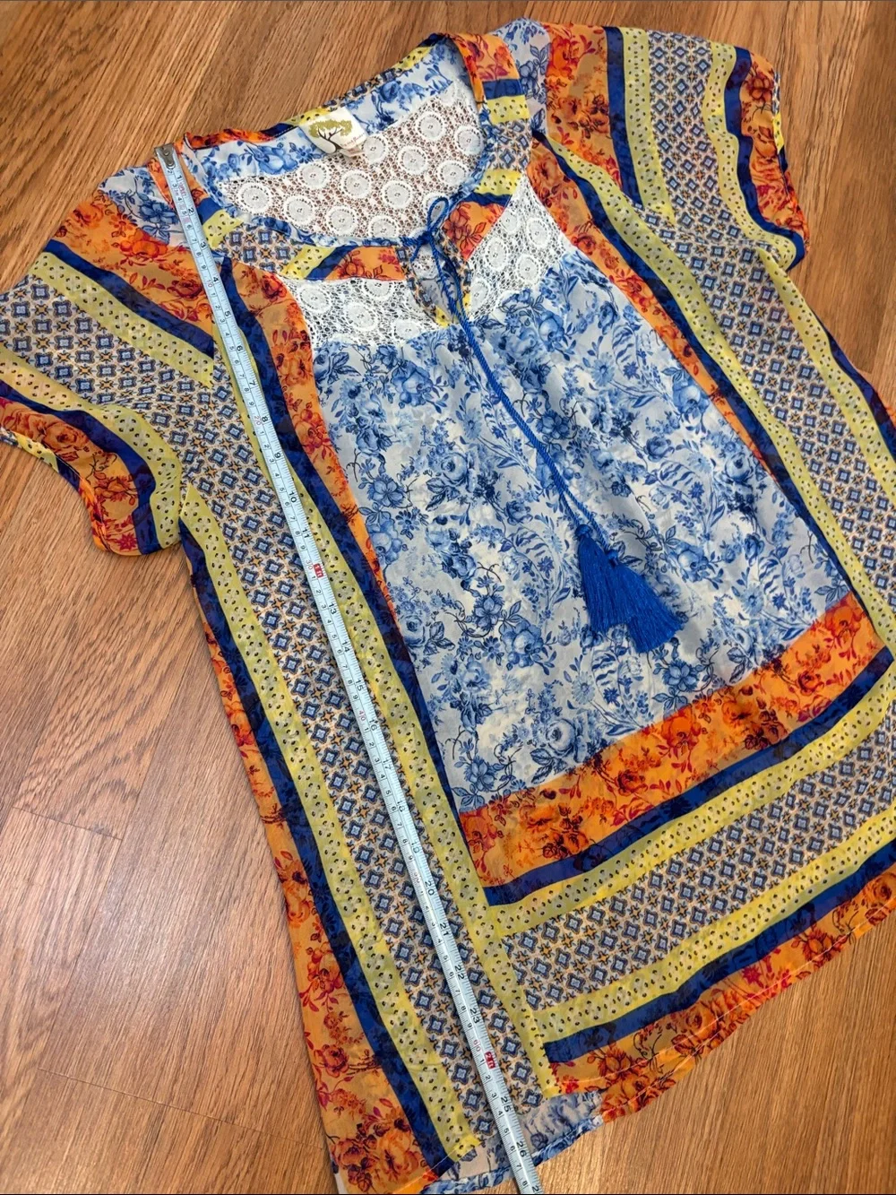 Fig & Flower blue, yellow & orange short sleeve semi-sheer top. Size M.